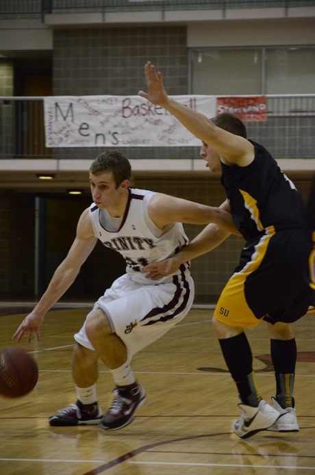 Sophomore guard Craig Saltarelli drives to the basket for a layup during last Saturday's 66-49 victory over Southwestern University. Photo by Matthew Brink.