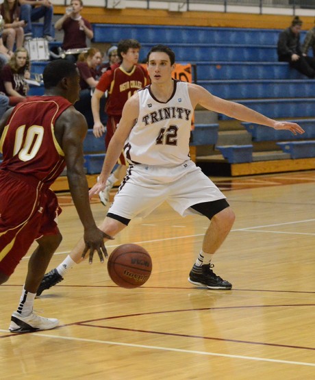 Junior forward Zach Lambert blocks a lay-up by Austin College during last Friday's men's basketball game in Sams Gym. Photo by Megan McLoughlin.