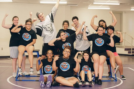 photo courtesy of Hollis MacDonald. Volunteers pose with students during Silver & Black Give Back's Team Up Challenge, which involves college students in serving students from kindergarten to twelfth grade. Photo courtesy of Hollis MacDonald.