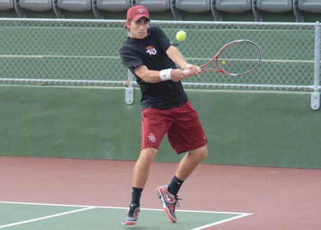 Sophomore captain of the men's tennis team Jordan Mayer hits a backhand during last Friday's tennis match against Kalamazoo College in which the Tigers won 9-0. Photo by Megan McLoughlin.