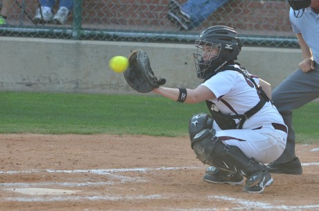 Junior catcher Ana Garcia catches a line drive while warming up between innings in the Tigers' 2-0 loss to Mary Hardin-Baylor last Tuesday. Photo by Aidan Kirksey.